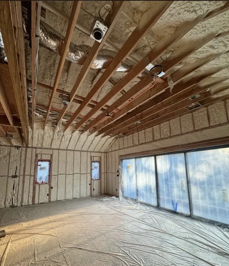 Interior walls and ceiling insulated with spray foam during new construction in Tuscumbia